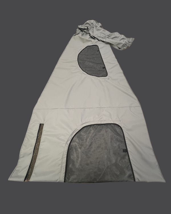 Light gray tent with mesh windows on a dark background