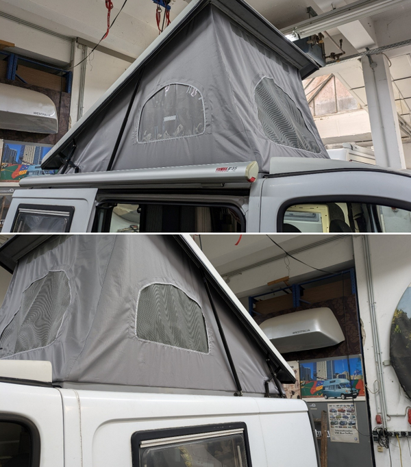 Gray rooftop tent attached to a vehicle in a garage setting opel vivaro sca roof